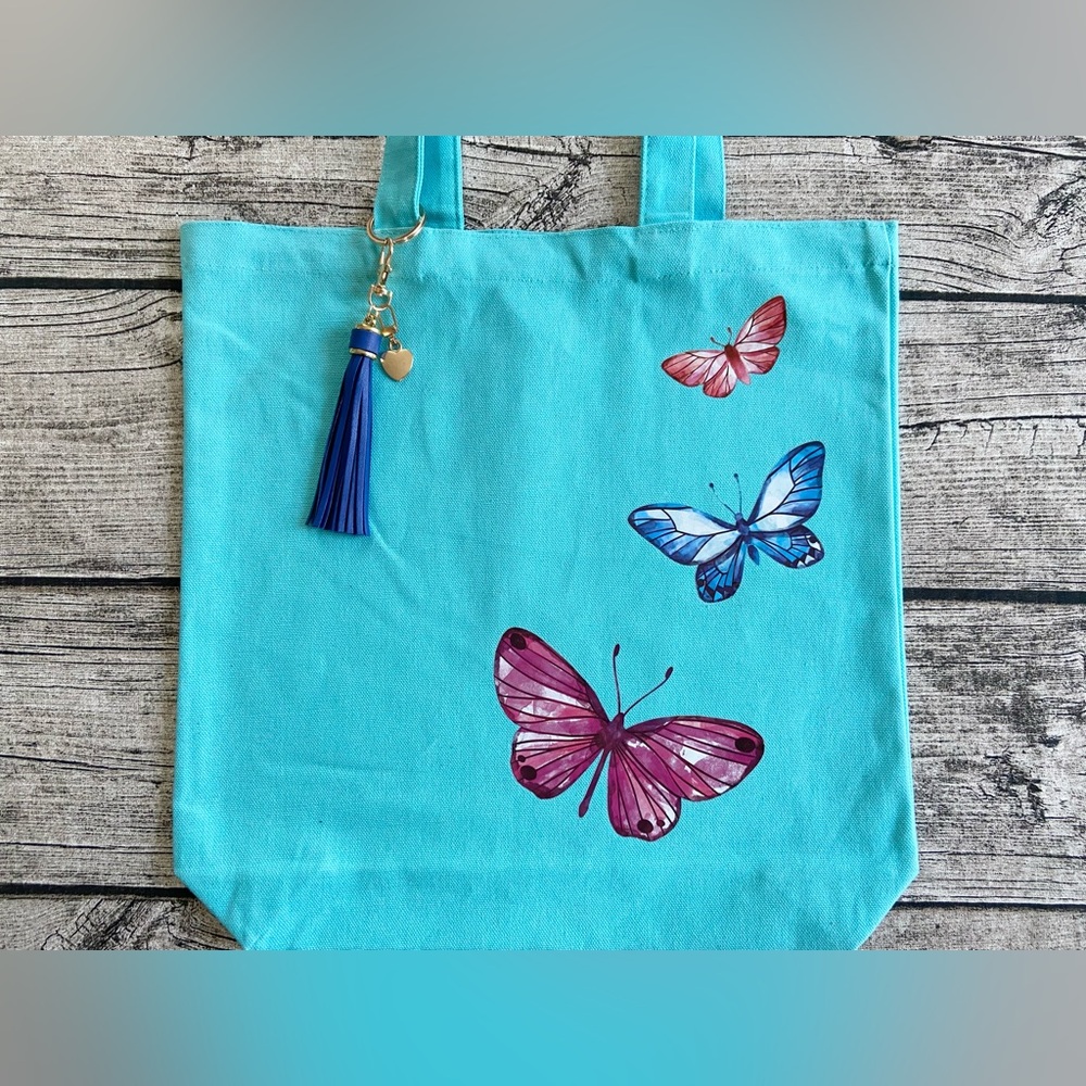 NWT. Set of bag + keychain/bag charm. Tote bag with removable keychain/bag charm